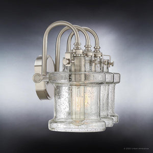 A beautiful UQL3981 Modern Farmhouse Bath Fixture 9.75''H x 24''W wall sconce from the Wrexham Collection with a unique clear glass shade, finished