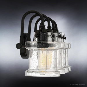 A gorgeous UQL3982 Modern Farmhouse Bath Fixture 9.75''H x 32''W, Natural Black Finish, Wrexham Collection wall sconce with a clear glass shade