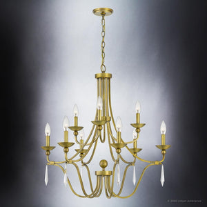 The Urban Ambiance UQL4072 XL Ayr Collection chandelier features an Olde Brass finish, ten candle-style bulbs, curved arms, and crystal accents, measuring 31''H x 32''W. Suspended by a chain against a gradient gray background.