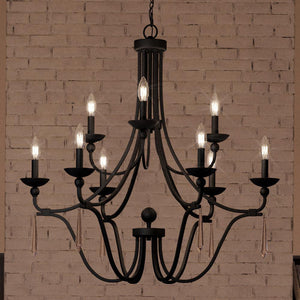 An Urban Ambiance UQL4073 Traditional Chandelier 31''H x 32''W, Parisian Bronze Finish, Ayr Collection lighting fixture hanging in front of a brick wall.