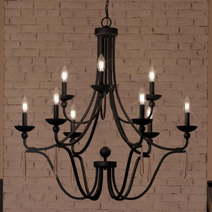 An Urban Ambiance UQL4073 Traditional Chandelier 31''H x 32''W, Parisian Bronze Finish, Ayr Collection lighting fixture hanging in front of a brick wall.