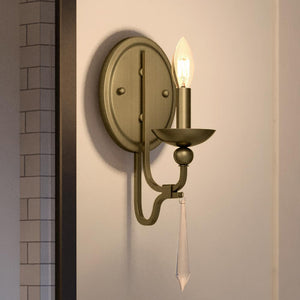 A unique Urban Ambiance UQL4074 Traditional Wall Sconce 14.5''H x 5''W, Olde Brass Finish, Ayr Collection with a candle on