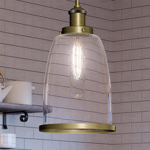 An UQL4080 Transitional Pendant 13.5''H x 8''W, Antique Brass Finish from the Wyndford Collection by Urban Ambiance, a unique lighting fixture hanging over a