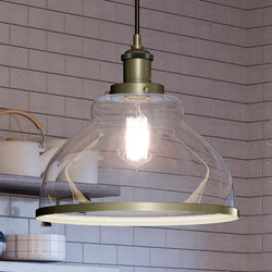 A unique UQL4083 transitional pendant lamp with antique brass finish from the Wyndford Collection by Urban Ambiance, adding luxury to a kitchen counter.
