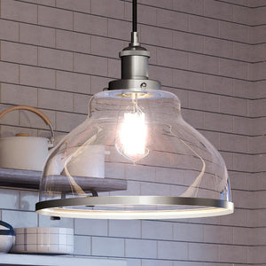 A unique glass pendant lighting fixture hanging over a luxury kitchen counter.