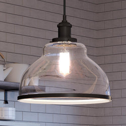 A beautiful UQL4085 Transitional Pendant 11.75''H x 12''W, Black Bronze Finish, Wyndford Collection by Urban Ambiance hanging over a kitchen counter.