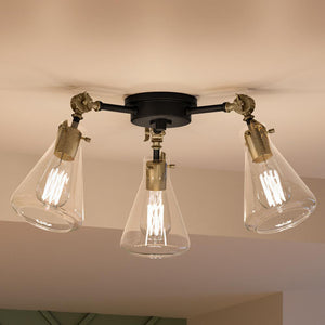 Three gorgeous UQL4100 Industrial Chic Ceiling fixtures hanging from a ceiling in a room.