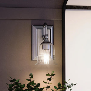 An Urban Ambiance UQL4111 Traditional Wall Sconce 10''H x 5''W with a unique lighting fixture next to it.