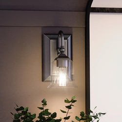 A unique and beautiful Urban Ambiance UQL4112 Traditional Wall Sconce 10''H x 5''W with a plant on it.