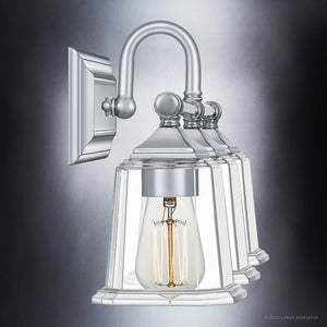 A luxury wall sconce with a clear glass bulb by Urban Ambiance.