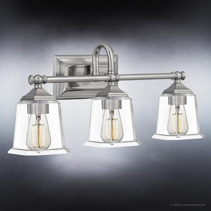 Three UQL4118 Traditional Bath Fixtures with clear glass shades providing gorgeous lighting from the Edinburgh Collection by Urban Ambiance.