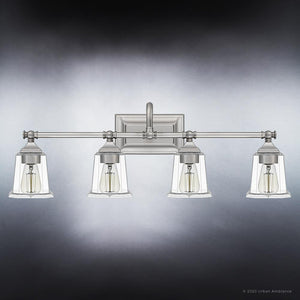 Four UQL4121 Traditional Bath Fixtures with clear glass shades, adding luxury to your bathroom.