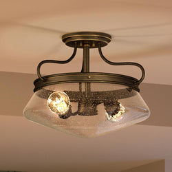 A unique lighting fixture, the Urban Ambiance UQL4161 Craftsman Ceiling 11''H x 14''W European Bronze Finish light fixture features a glass shade.