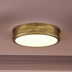 A unique lighting fixture in a room by Urban Ambiance.