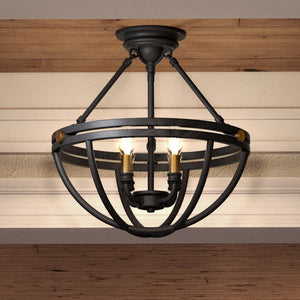 The Urban Ambiance UQL4240 Bridgend Collection modern farmhouse ceiling light features an estate bronze finish, sculptural open spherical cage, and three exposed bulbs. Measures 14''H x 15.75''W.