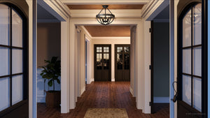 A hallway with wooden floors, white trim, and double doors at both ends features a potted plant on the left and the Urban Ambiance UQL4240 Modern Farmhouse Ceiling Light in estate bronze from the Bridgend Collection overhead.