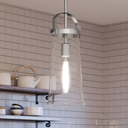An Urban Ambiance UQL4250 Classic Pendant 17''H x 7''W, with an Aged Nickel Finish from the Pembroke Collection, hanging over a kitchen counter, featuring a
