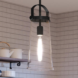 A beautiful Urban Ambiance UQL4251 Classic Pendant with an Estate Bronze Finish, hanging over a kitchen counter.