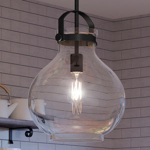 A unique UQL4254 Classic Pendant lighting fixture hangs gracefully over a kitchen counter.