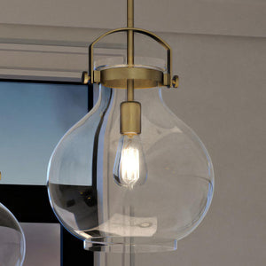 A unique and gorgeous UQL4255 Classic Pendant featuring a glass globe, Rustic Brass Finish from the Pembroke Collection by Urban Ambiance.