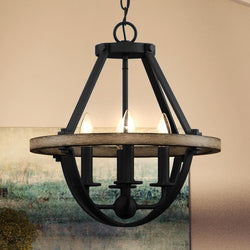 A beautiful, luxury chandelier from the Barry Collection, in Natural Black Finish, hanging in a room.