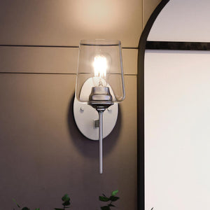 A unique lighting fixture, the UQL4270 Traditional Wall Sconce from the Taunton Collection by Urban Ambiance features a polished chrome finish and a plant on it.