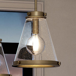 A beautiful Urban Ambiance UQL4292 Modern Farmhouse Pendant 14.75''H x 13''W, Rustic Brass Finish, Tiverton Collection with a glass shade