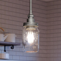 An Urban Ambiance UQL4344 Industrial Chic Pendant 9.5''H x 4.25''W, Galvanized Steel Finish, Dallas Collection unique hanging lamp in a kitchen.