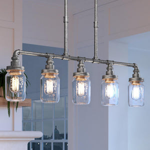 Four beautiful UQL4348 luxury chandeliers hanging over a kitchen island by Urban Ambiance.