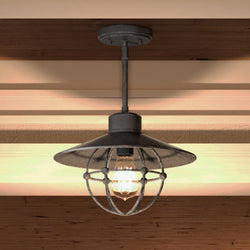 An Urban Ambiance UQL4380 Nautical Pendant 9.75''H x 13''W, Silver Etch Finish, Truro Collection hanging from a wooden ceiling with a unique touch