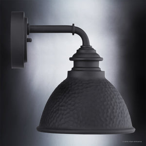 An UHP1174 Hammered Outdoor Wall Light by Urban Ambiance on a black background.