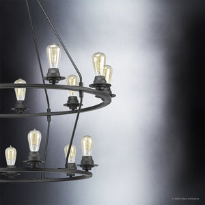 The Urban Ambiance UHP2247 XL Industrial Chandelier from the Nashville Collection features a charcoal finish and two circular tiers adorned with exposed Edison-style bulbs, displayed against a gray gradient background.