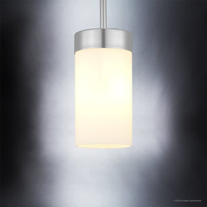 The Urban Ambiance UHP2307 Transitional Pendant Light from the Madison Collection features an etched white glass cylindrical shade and a polished chrome finish, elegantly illuminated against a gradient gray background.