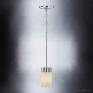 The Urban Ambiance UHP2307 Transitional Pendant Light from the Madison Collection features an etched white glass cylindrical shade suspended from a chain and rod, mounted to a polished chrome finish round ceiling plate, set against a gradient gray background. This fixture measures 7″ by 5-1/8″.