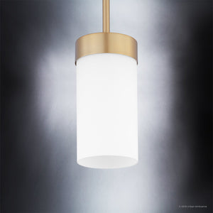 Introducing the Urban Ambiance UHP2309 Transitional Pendant Light from the Madison Collection, featuring a brushed bronze finish and a 7″ x 5-1/8″ etched glass cylinder shade. This contemporary lighting fixture elegantly suspends against a neutral gray background, blending modern sophistication with timeless appeal to create an eye-catching focal point for any space.