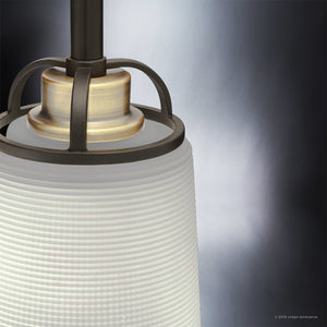 Close-up of the Urban Ambiance UHP2764 Transitional Chandelier from the Boise Collection, showcasing its Olde Bronze finish, textured frosted glass shade, brushed metal accents, and dark frame set against a gradient background.