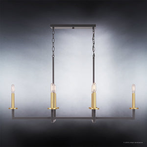 The Urban Ambiance UHP2803 Modern Farmhouse Chandelier from the Cordoba Collection features a striking geometric rectangular design with a charcoal finish, four vertical gold candle-style bulb holders, and hanging chains, creating an elegant two-tone look against a gradient background.