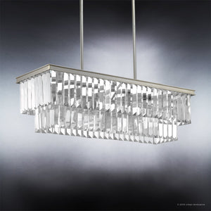 The UHP2883 Cosmopolitan Chandelier from the Lille Collection by Urban Ambiance features an Antique Silver finish, a rectangular design with two metal rods, and two tiers of prismatic glass prisms, elegantly suspended against a gradient gray background. Measuring 11″ x 33-7/8″, this piece is both modern and sophisticated.
