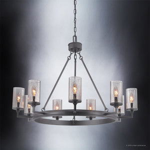 The Urban Ambiance UHP2892 XL Rustic Chandelier from the Livorno Collection features a charcoal finish, eight candle-style bulbs with clear glass shades, and hangs from a chain for a refined rustic industrial appeal. Size: 24-7/8