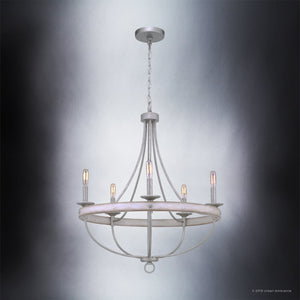 The Urban Ambiance UHP2900 Farmhouse Chandelier from the Adelaide Collection, featuring a galvanized steel finish and measuring 30″ x 26″, is suspended from the ceiling against a gray gradient background, effortlessly blending contemporary style with vintage-inspired chandelier charm.