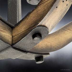 Close-up of the UHP3030 Rustic Chandelier from the Wycombe Collection by Urban Ambiance, featuring a metal joint with bolts and wood accents in an Olde Iron finish, set against a dark background.