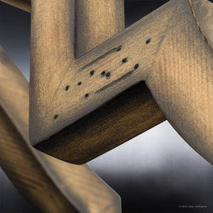 Close-up of a wooden frame corner showcasing visible wood grain and small holes, photographed against a blurred background—a detail that perfectly complements the charming, rustic aesthetic of the Urban Ambiance UHP3030 Rustic Chandelier (24-1/2″ x 22″, Olde Iron Finish) from the Wycombe Collection.